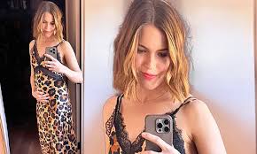 Pregnant Mandy Moore cradles burgeoning bump one day after ...
