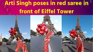 Arti Singh posed in red glittering saree in front of Eiffel Tower abroad
